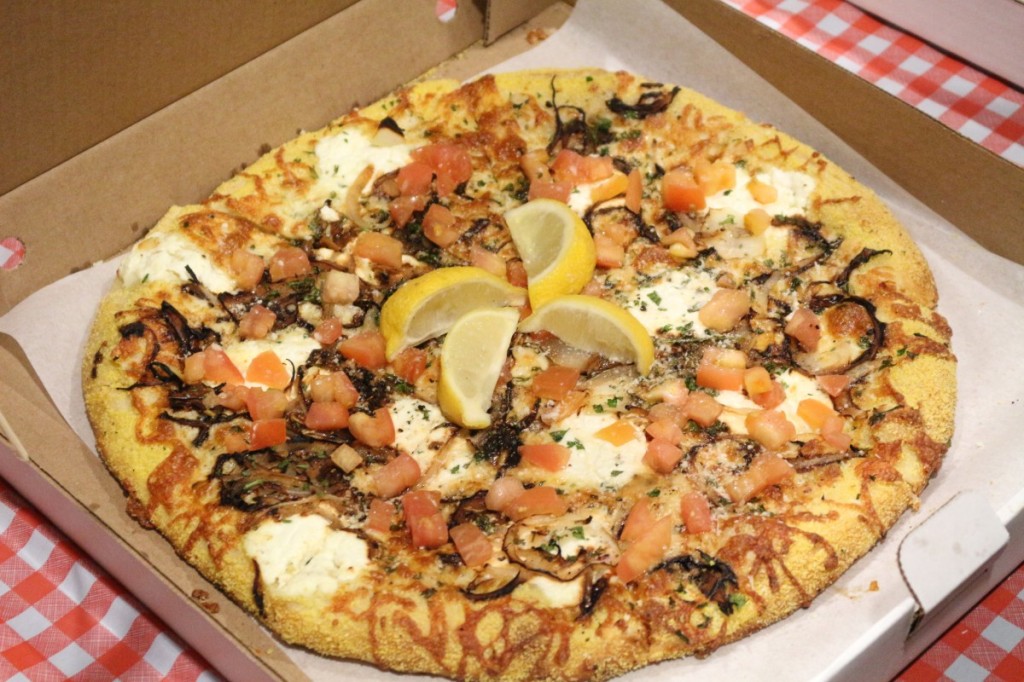 Salvatore's Bianco in Stephano: garlic infused oil, cornmeal edged crust, mozzarella, onions, ricotta, parsley, parmesan, romano cheese, fresh tomatoes, herbs & a squeeze of lemon.